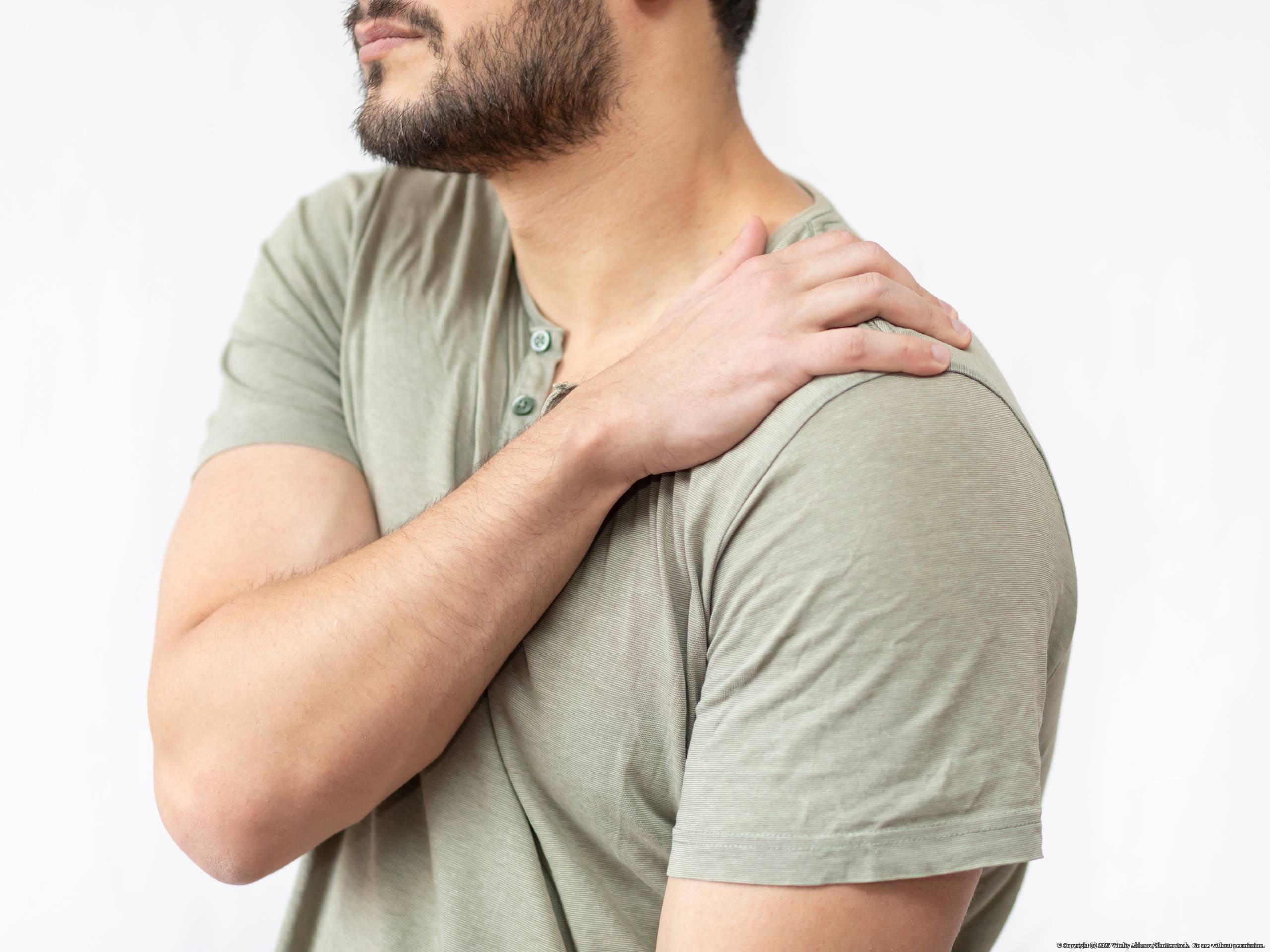 Young,Man,Suffering,From,Shoulder,Pain,Isolated,On,White,Background